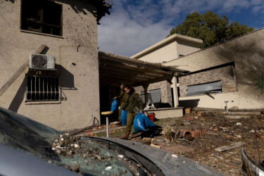 KIRYAT SHMONA, ISRAEL - NOVEMBER 26: Soldiers carry out objects after a house was struck by a rocket fired from Lebanon on 26/11/2024 in Kiryat Shmona, Israel. Israel's cabinet is discussing a proposed 60-day ceasefire deal with Hezbollah, the Lebanese militant group whom Israel launched a ground invasion against almost two months ago, after trading cross-border fire since early October 2023. (Photo by Amir Levy/Getty Images)