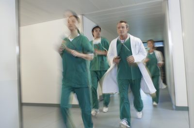 Doctors Running in Hospital Corridor